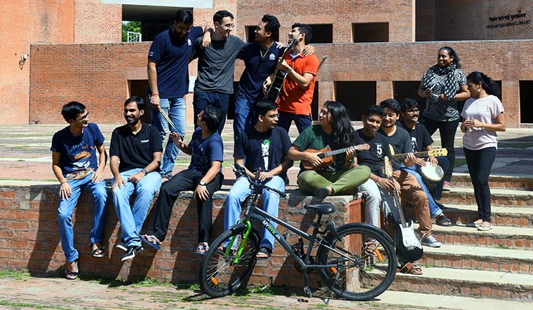 Songs in the sun: Members of the IIMA music club and staff at the Louis Kahn Plaza.