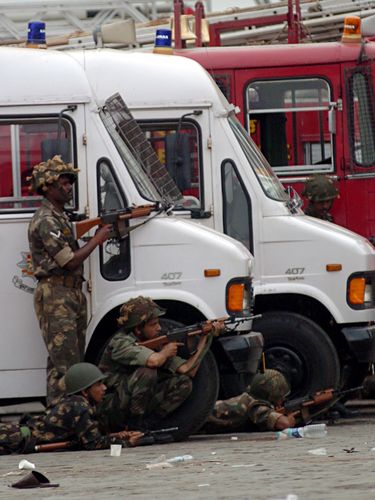 Target zone: Indian Army personnel take position near the Taj hotel during the 26/11 attacks.