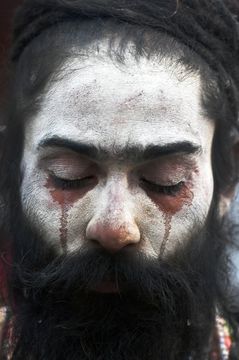 Depths of devotion: a sadhu meditates amid fumes from the yagna kund.
