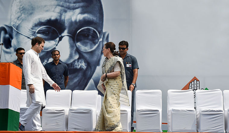 Seat of power: Congress president Sonia Gandhi with Rahul Gandhi at Rajghat to commemorate the 150th birth anniversary of Mahatma Gandhi | PTI