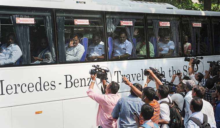 Wheeling and dealing: Shiv Sena MLAs being moved to a hotel on November 25 | PTI