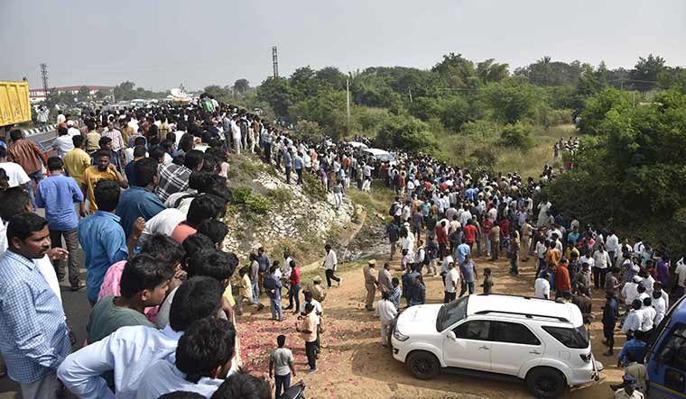 Shot at site: Crowds gather at the encounter site where the police shot dead  the four accused in the Disha murder case.