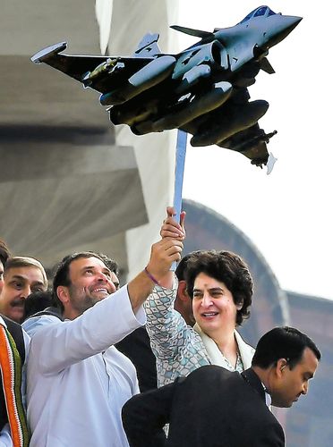 Hope in the air: Congress president Rahul Gandhi and party general secretary Priyanka Gandhi Vadra holding a model of Rafale during a roadshow in Lucknow on February 11 | Salil Bera