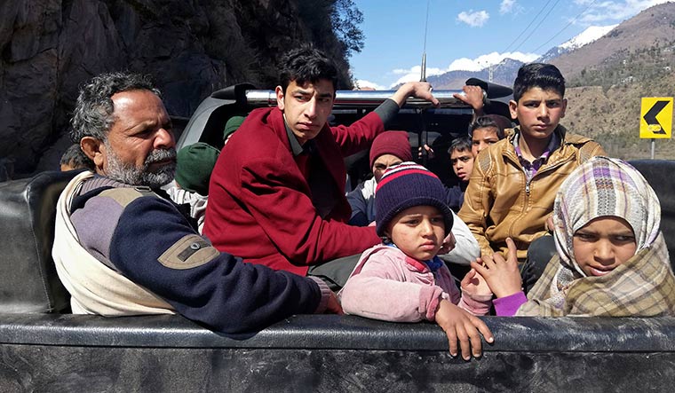 Caught in the crossfire: People flee Chakothi, in PoK, following an intense exchange of fire between Pakistan and India on the LoC | AP