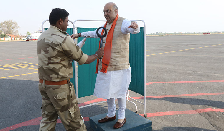Safety first: Shah undergoing security check before boarding an aircraft. National security is a key theme for Shah and the BJP | D. Ravinder Reddy