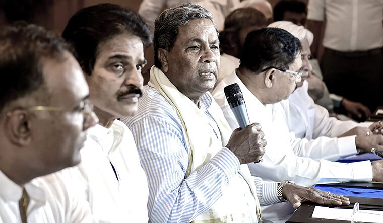 Bad phase: (From left) Dinesh Gundu Rao, K.C. Venugopal and Siddaramaiah during the Karnataka Congress legislature party meeting | PTI