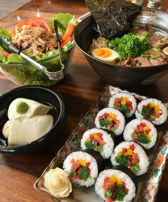 (Clockwise from top left) Manami’s bab ban ji salad, shoyu tonkotsu ramen, veg futomaki and Manami tofu | Aayush Goel