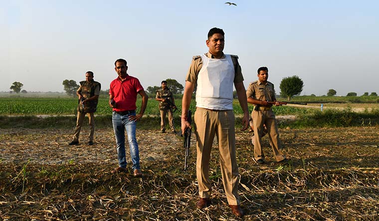 Men at work: Jitender Kumar Sargam, deputy superintendent of police, with his team at an encounter site near Meerut | Sanjay Ahlawat