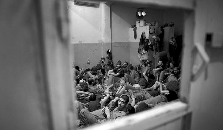 A crammed cell in the prison in Al-Hasakah. Many former Islamic State men kept here suffer from physical and mental health issues.