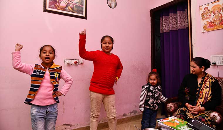 Six-year-old Shagun Mishra (left), who shifted from a private school to a government school, plays with her sisters | Sanjay Ahlawat