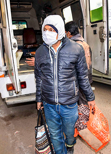 Safety check: A student who arrived from China on his way to the Patna Medical College and Hospital for a checkup | PTI