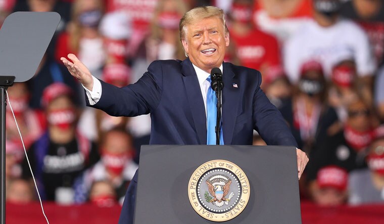 Renaming the virus: United States President Donald Trump at a rally in Jacksonville, Florida. Trump has often called the novel coronavirus 'China virus', claiming that
he has evidence it was manufactured in China. Yan's report fits well with Trump's
'China virus' narrative | AFP