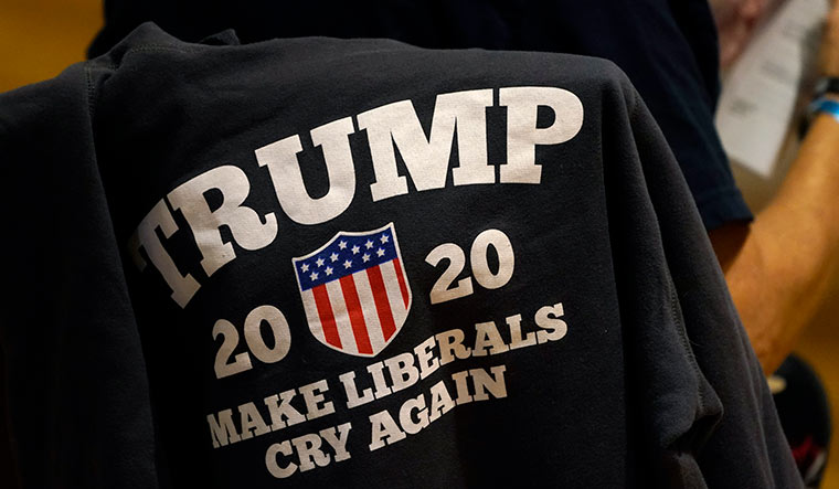 A Trump supporter at a campaign rally in Manchester, New Hampshire | AP