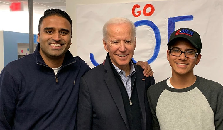 Close ties: Maju Varghese and his son with Joe Biden.