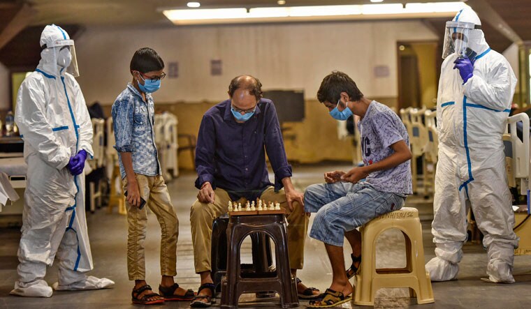 Moves and the men: Covid-positive patients play chess inside a quarantine centre attached to Lok Nayak Jai Prakash Narayan Hospital in New Delhi | Getty Images