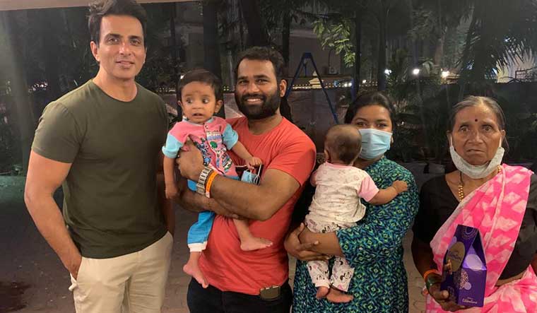 Sweet meet: Snehal misal (second from right), and her family with sood. The actor arranged for her son’s heart surgery.