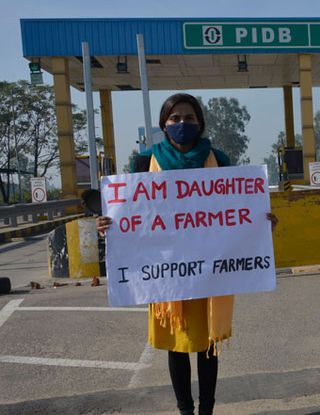 Farm and family: A protester at the Kurali toll plaza