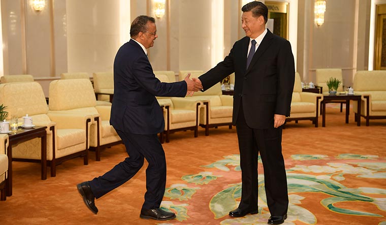 Hand in hand: WHO director-general Tedros Adhanom with Chinese President Xi Jinping in Beijing in January | Getty Images