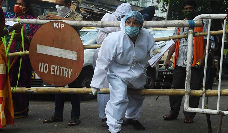 No Barriers: A municipal worker during a door-to-door survey in Kolkata | AFP