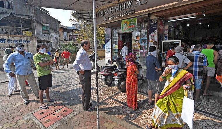 People stand in a queue maintaining physical distance to buy grocery outside a store during the coronavirus pandemic in Vasai. THE WEEK Picture by Amey Mansabdar (Story/ Online) 26/03/2020