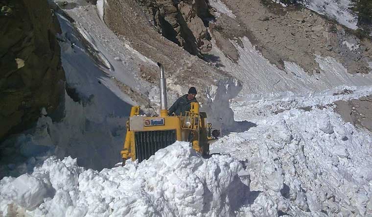 Making way: A worker clearing snow near Kalapani | BRO