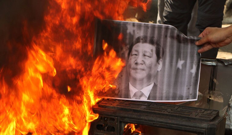 Object of hate: Members of Shiv Sena and Dogra Front in Jammu burn a photo of Chinese President Xi Jinping