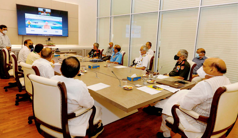 Talking heads: Defence Minister Rajnath Singh, along with chiefs of the defence forces, during a meeting in Delhi on June 29 | PTI
