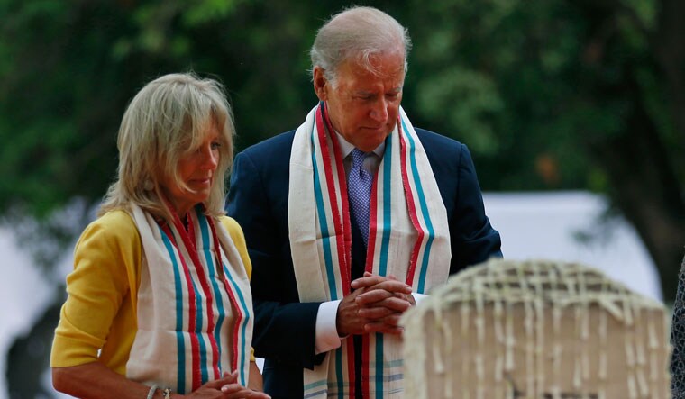 Warm tribute: Joe Biden and his wife, Jill, pay respects to Mahatma Gandhi during their trip to India in July 2013 | AP