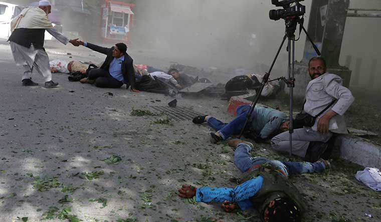In the line of fire: Afghan journalists after a blast in Kabul | Reuters