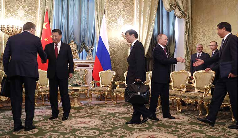 Hidden ruler: Wang with Xi and President Vladimir Putin of Russia during a bilateral meeting at the Kremlin in Moscow in July 2017 | Getty Images