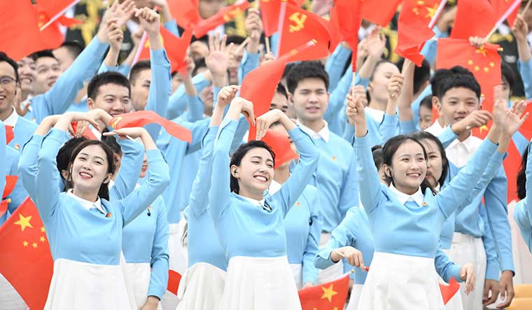 Unrivalled joy: Young Chinese celebrating the100th anniversary of the Communist Party of China in Tiananmen Square.