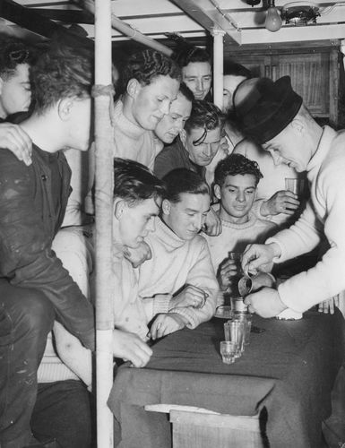 Making merry: British sailors collecting  their ration of rum during World War II | Getty Images