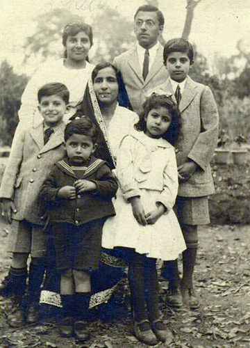 With his parents and siblings (he is on the left in the suit) | Parzor Foundation Archives