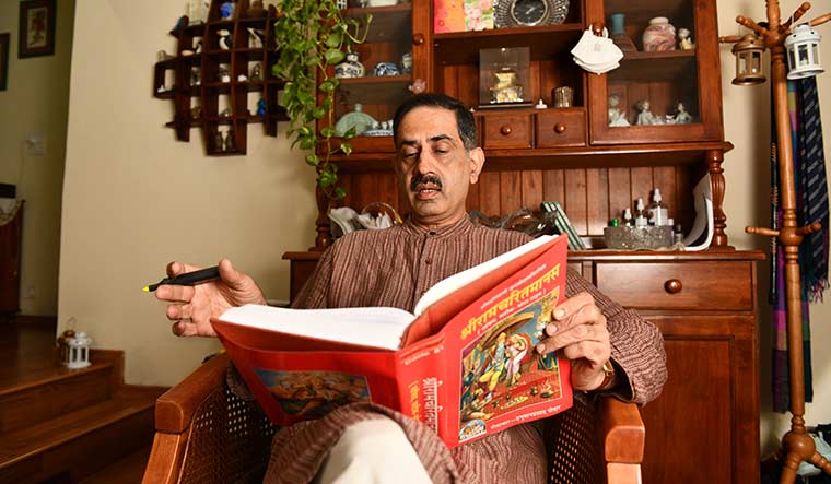 Notes from the divine: Bhargava reading the Ramayana at his house.