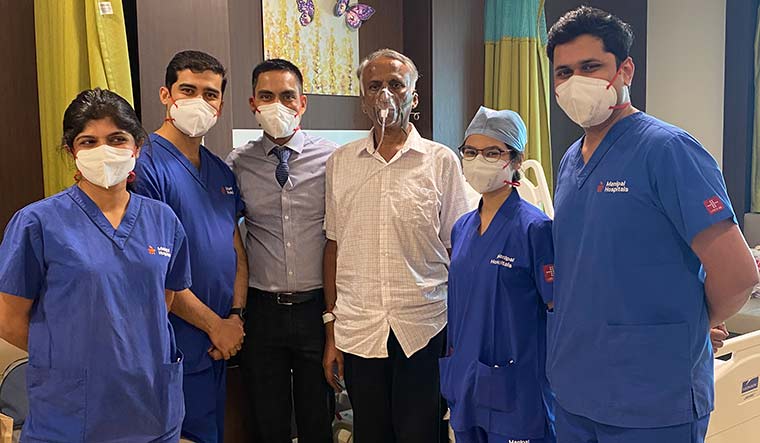 Resilient, resolute: Venugopala with hospital staff.