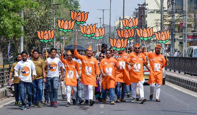 Saffron wave: BJP workers take out a rally at Jalukbari in Guwahati | PTI