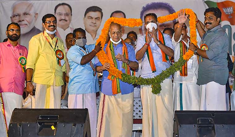 New mascot: E. Sreedharan being inducted into the BJP at an event in Malappuram on February 25 | PTI