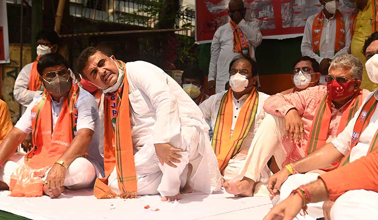 Hot seat: Suvendu Adhikari (left) and Dilip Ghosh protest political violence in Kolkata | Salil Bera