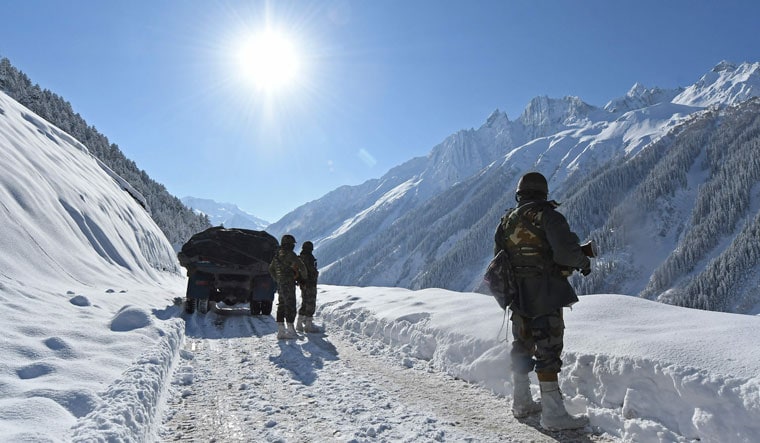 High altitude challenge: Indian soldiers on a snow-covered road near Zoji La Pass | AFP
