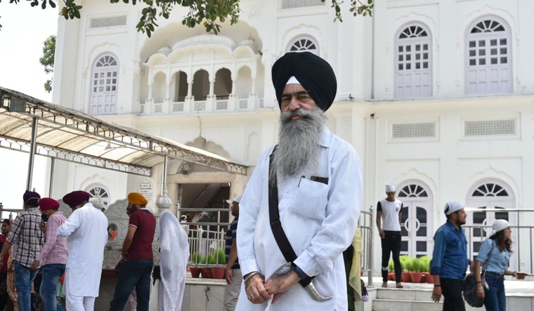 Holy ground: Surinder Singh in front of Kesgarh Sahib gurdwara | Aayush Goel