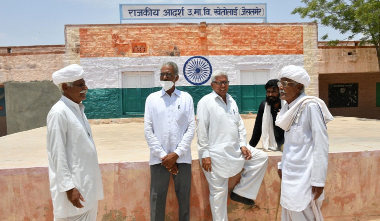 Nuclear, unclear: Ram Rattan (second from left) with other village elders in Khetolai | Arvind Jain