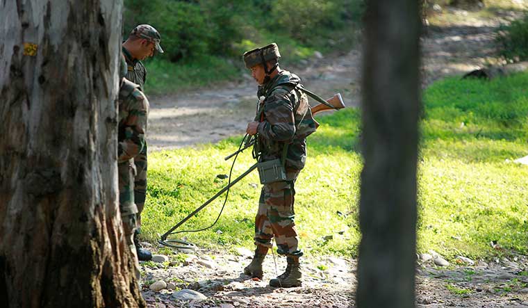 Eyes wide open: Indian Army soldiers check for explosives during a search operation at Domana army camp in Jammu | AP