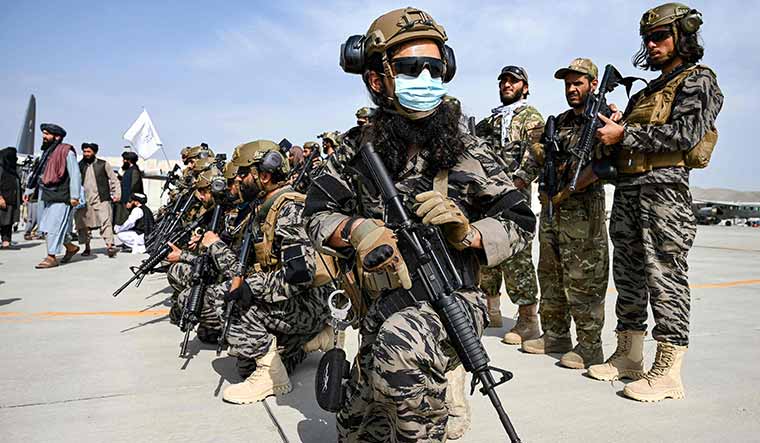 Change of guard: Soldiers of the Taliban special forces take position at Kabul airport on August 31 following the US pullout | AFP