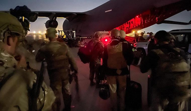 Leaving space: US paratroopers prepare to board a Boeing C-17 military aircraft at Kabul airport on August 30 | AFP