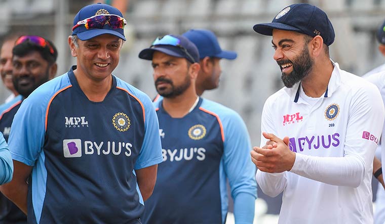 Victory’s man: Kohli with head coach Rahul Dravid after India’s victory in the two-match Test series against New Zealand in December 2021 | PTI