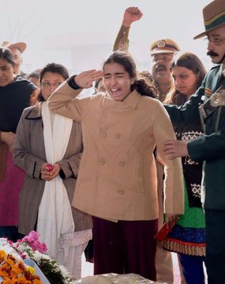 Emotional adieu: Alka salutes his father’s mortal remains with a Gorkha war cry on January 30, 2015 | PTI
