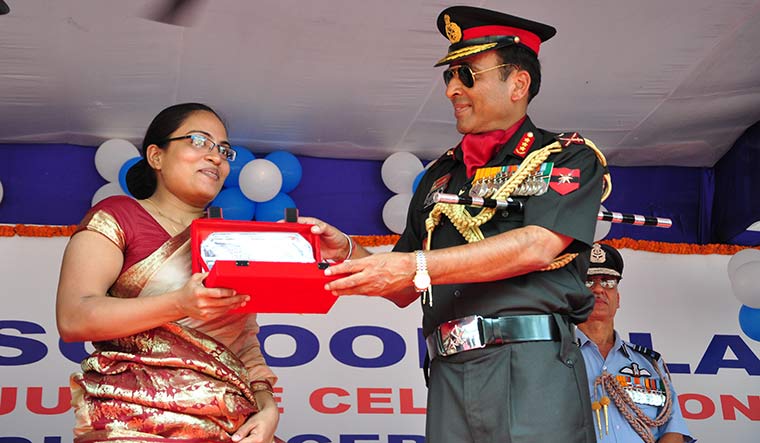 Memories to cherish: Major Minakshi Chandan being felicitated by Lt Gen Gyan Bhushan at the golden jubilee of Tilaiya Sainik School in Jharkhand, her husband’s alma mater.