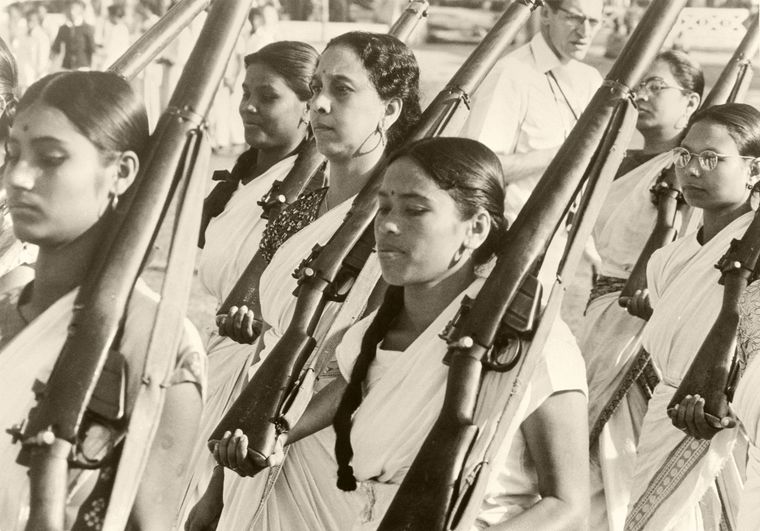 Fighting spirit: Women in Assam parade with rifles, responding to Nehru’s request to defend the country against Chinese troops | Getty Images