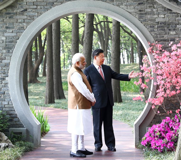 Wary neighbours: Prime Minister Narendra Modi and Chinese President Xi Jinping at a garden in Wuhan, China | AP