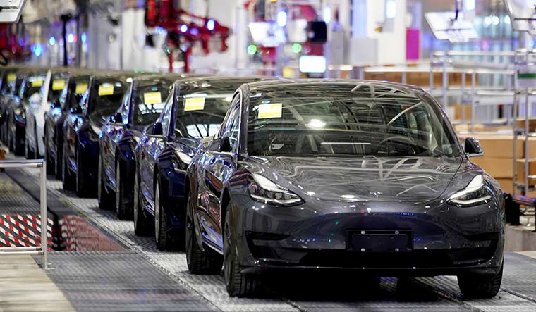 Driving ahead: Tesla Model 3 cars at a delivery event in China | Reuters